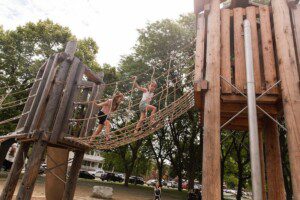 Children playing on playscape in Clark Park - Southwest Detroit