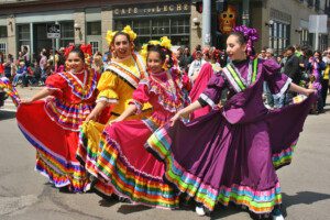 Women dressed up for a Cinco de Mayo celebration parade