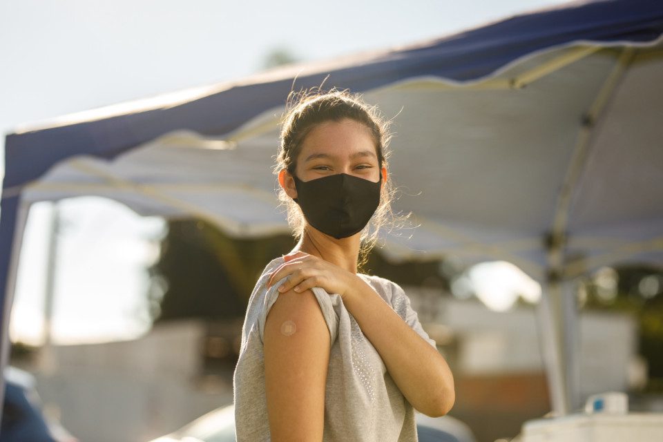 Responsible Woman Wearing Mask and Getting Vaccinated