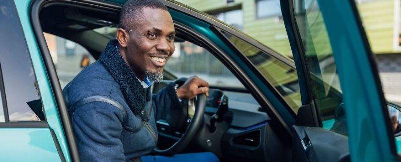 a man getting out of a car