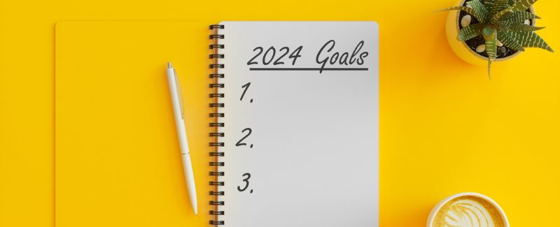 a notebook with 2024 goals