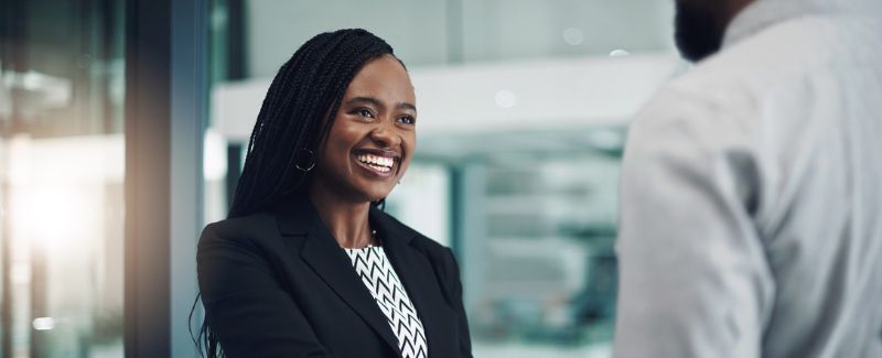 Shot of a young businesswoman shaking hands with a colleague